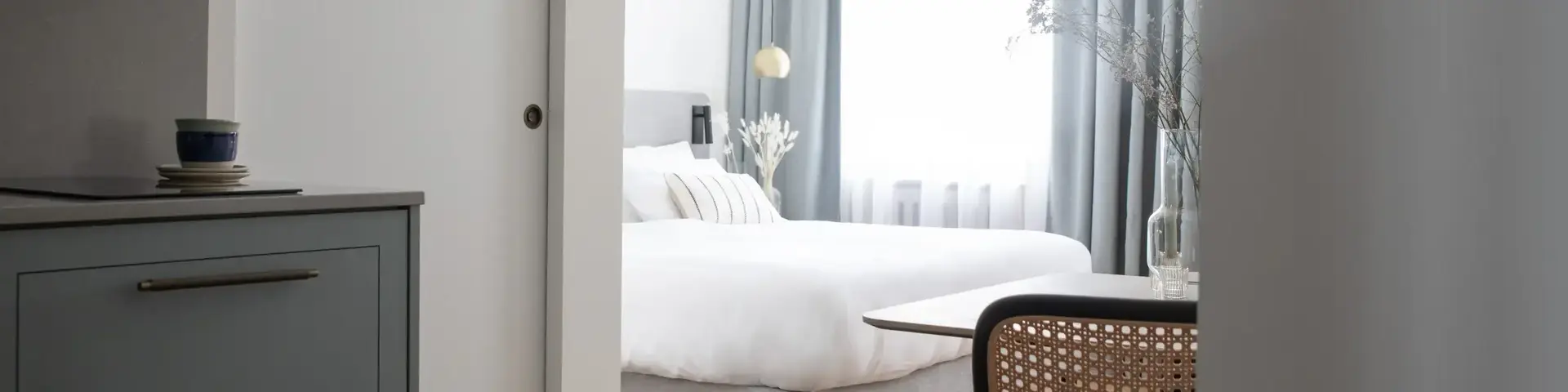 a bedroom with a bed and a table