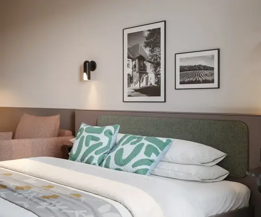 a bed with a chair and a table