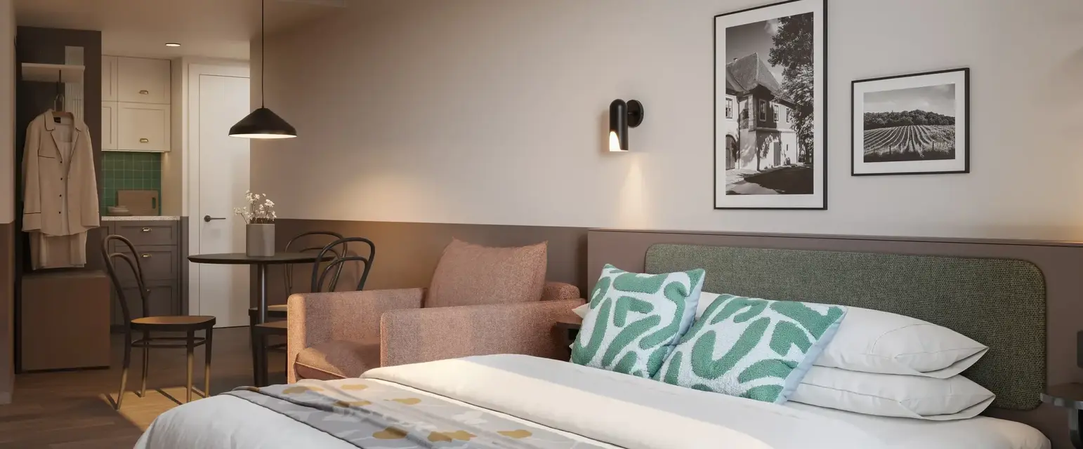 a bed with a chair and a table
