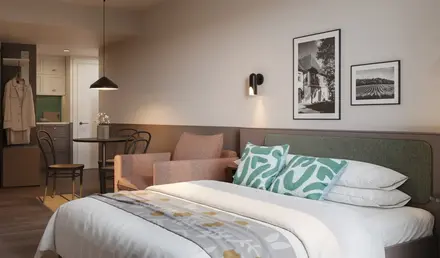 a bed with a chair and a table