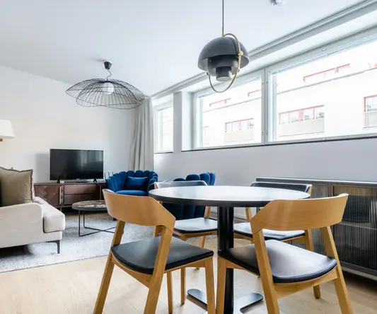 a room with a table and chairs