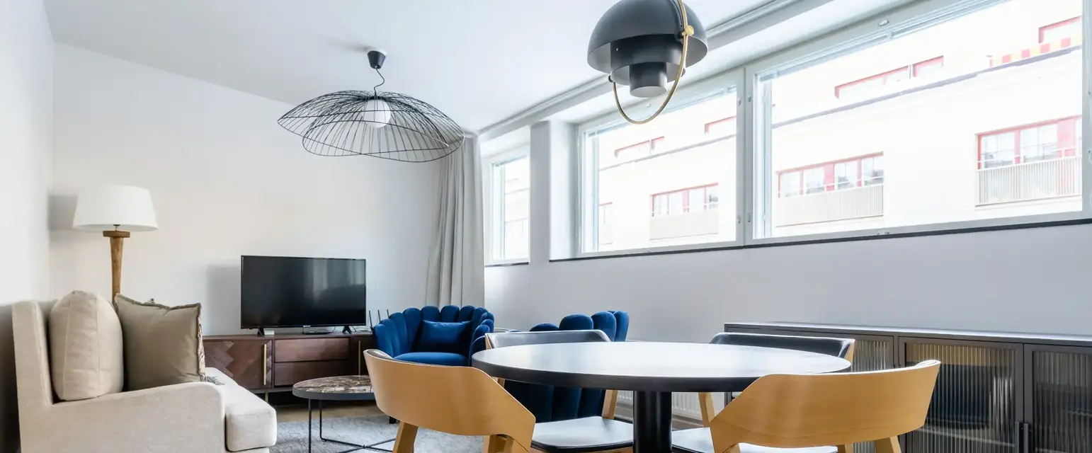 a room with a table and chairs