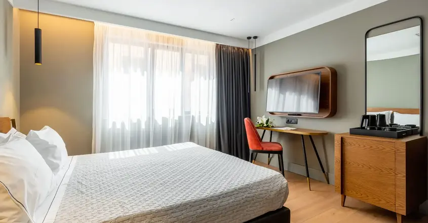 a room with a bed and a tv