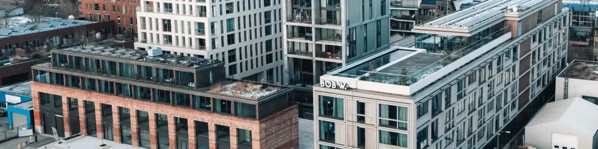 a group of buildings with a street in the background
