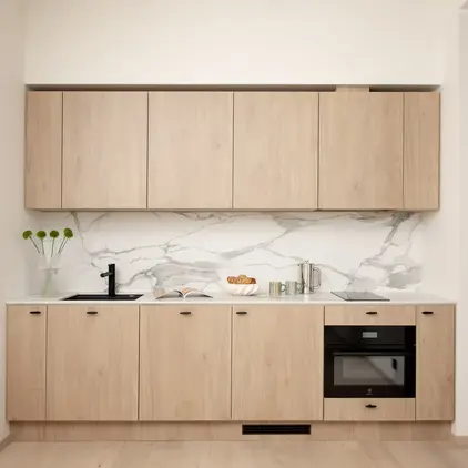 a kitchen with wood cabinets and a sink