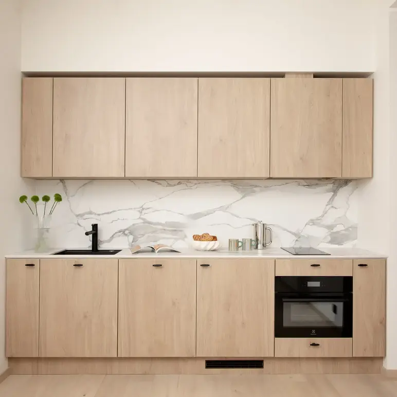 a kitchen with wood cabinets and a sink