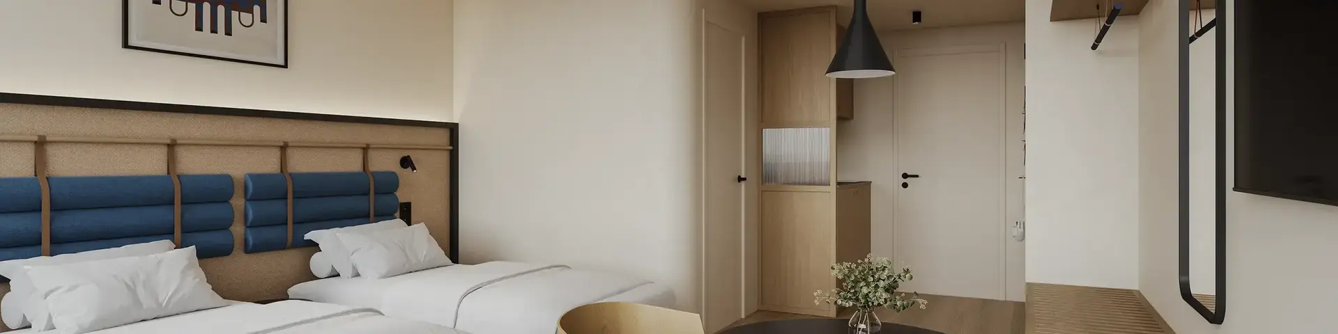a room with two beds and a table