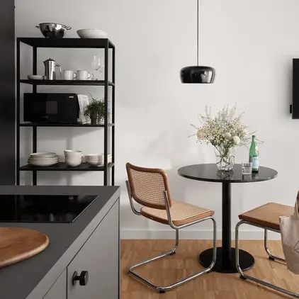 a kitchen with a table and chairs