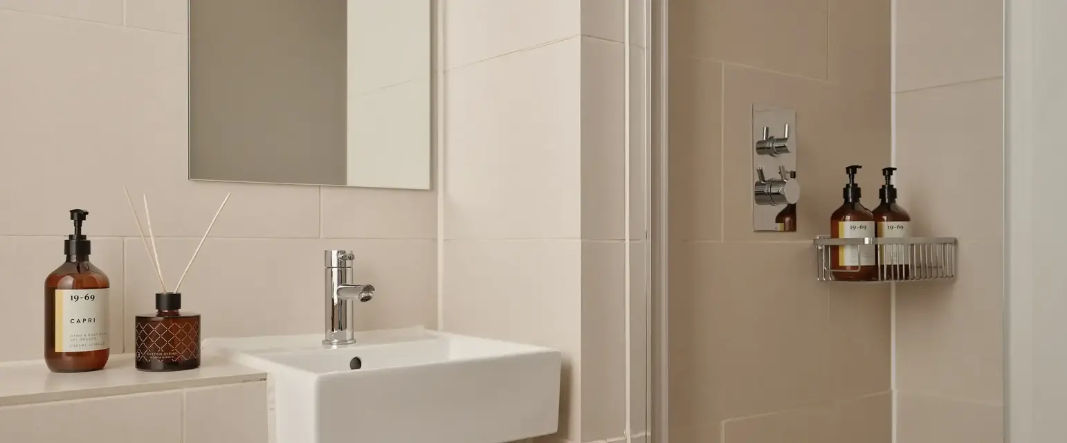 a bathroom with a mirror and sink