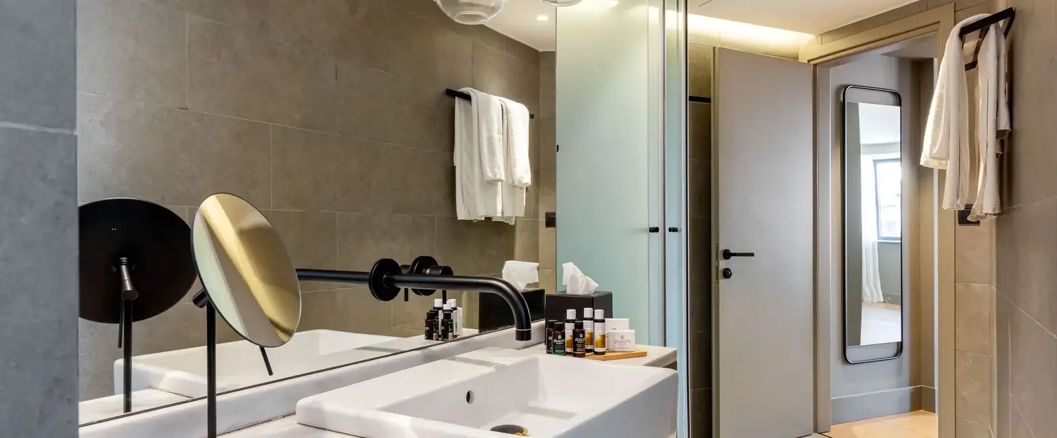 a bathroom with a sink and mirror