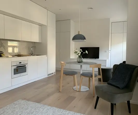 a room with a table and chairs