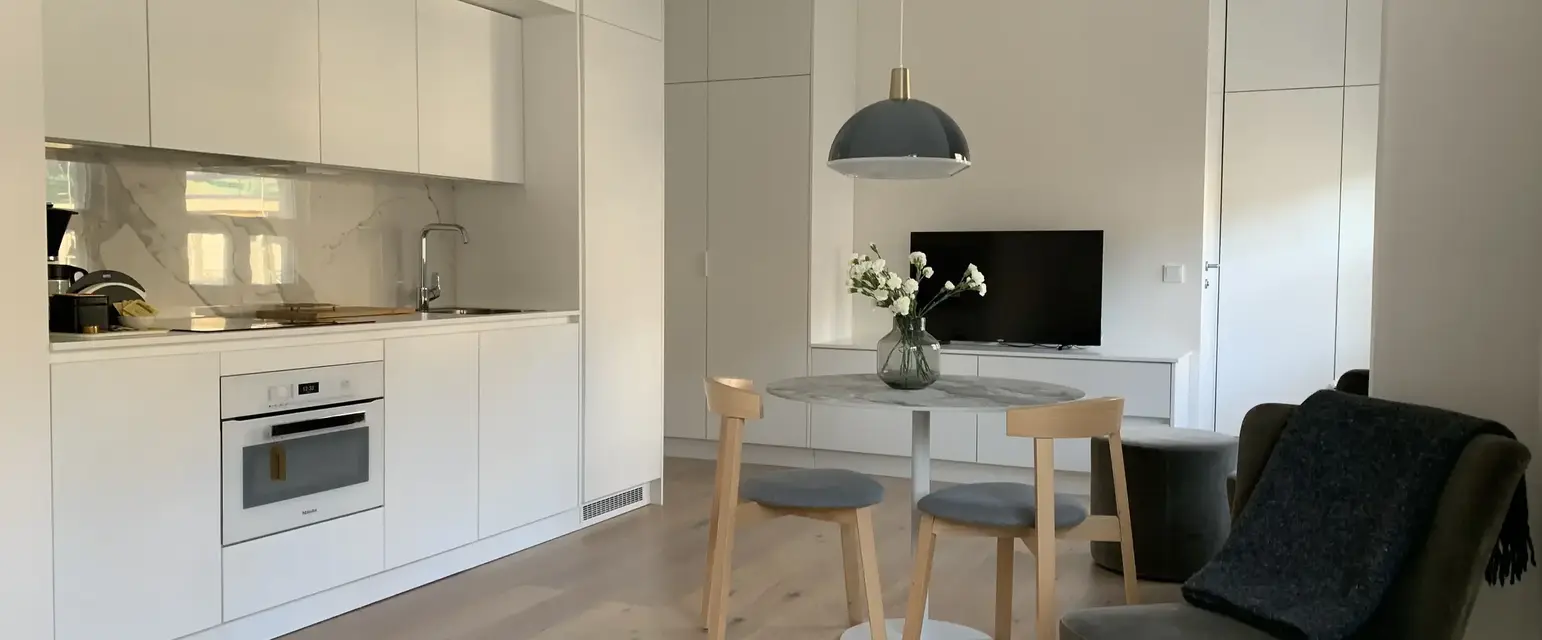 a room with a table and chairs