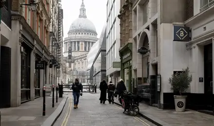 a group of people walking down a street