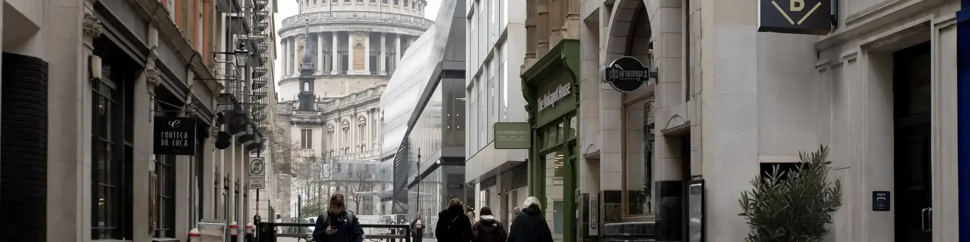 a group of people walking down a street