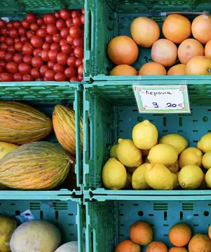 a group of fruit in green baskets