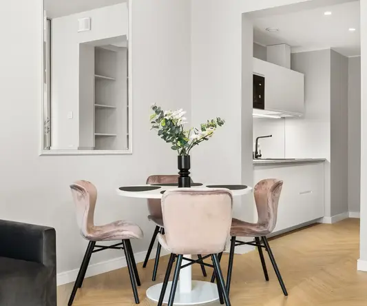 a table with chairs in a room
