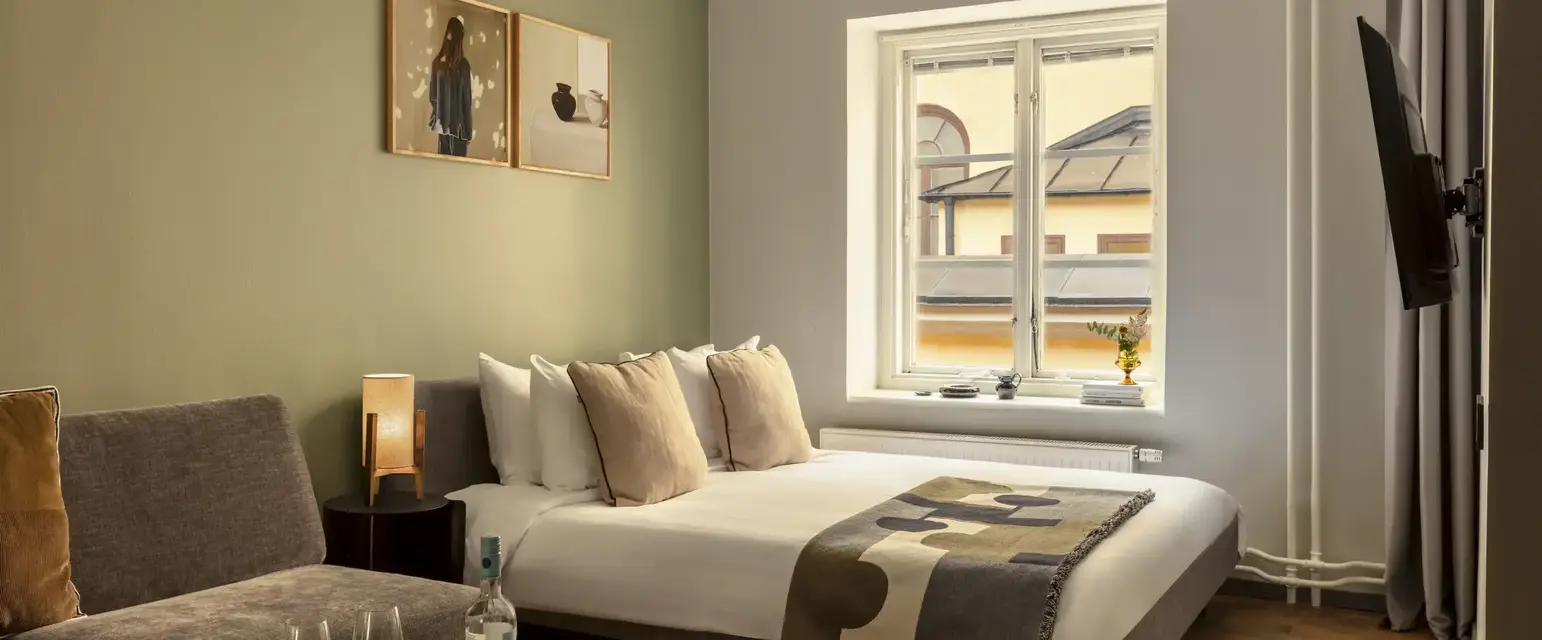 a bedroom with a bed and a couch