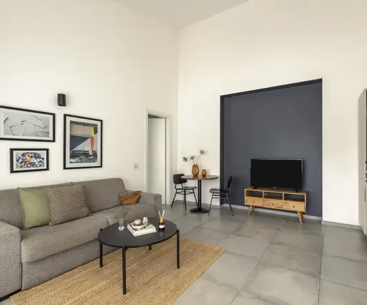 a living room with a couch and a table