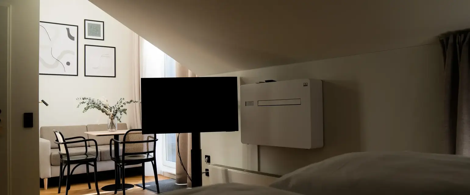 a room with a tv and a table