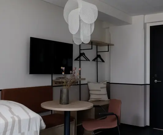 a room with a table and chairs