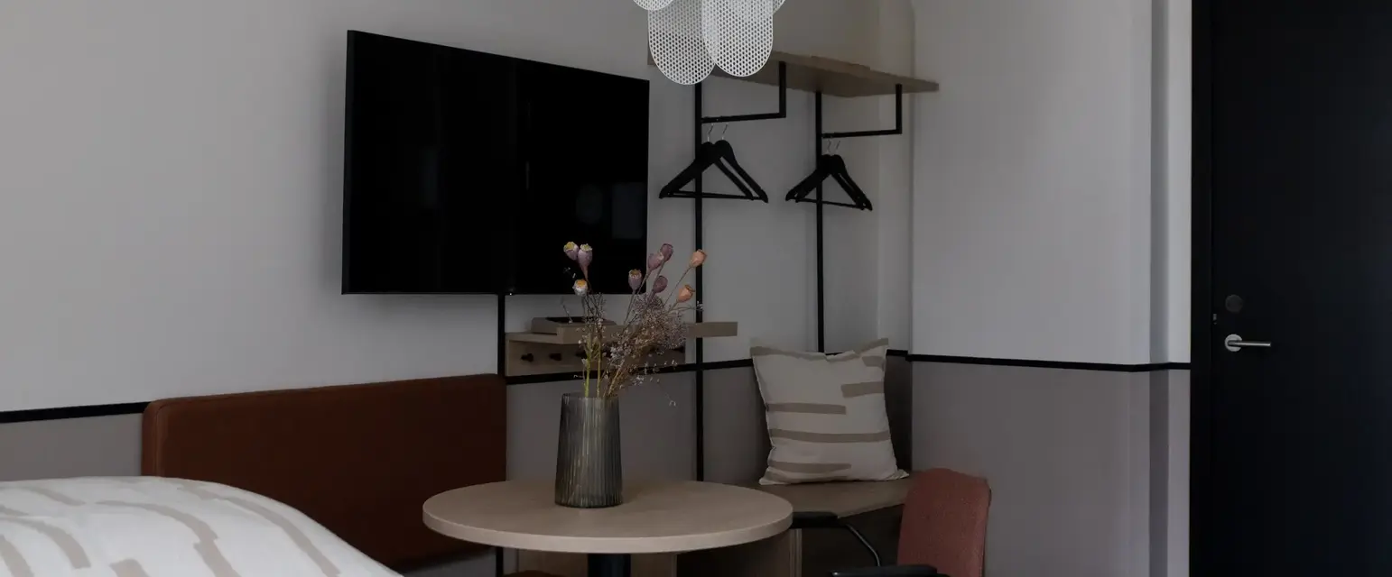 a room with a table and chairs