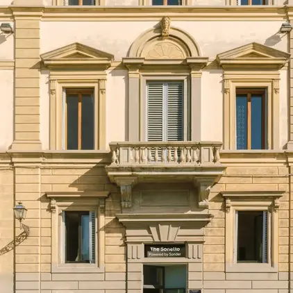 a building with a person walking in front of it
