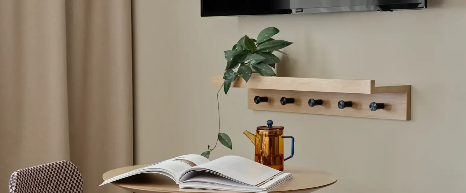a table with chairs and a book