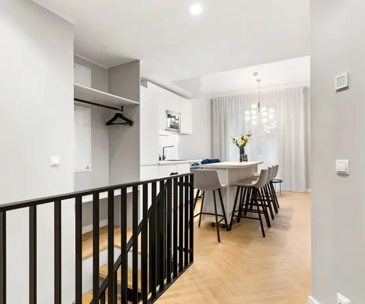 a room with a table and chairs