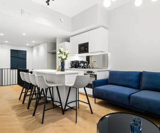 a room with a blue couch and a blue sofa