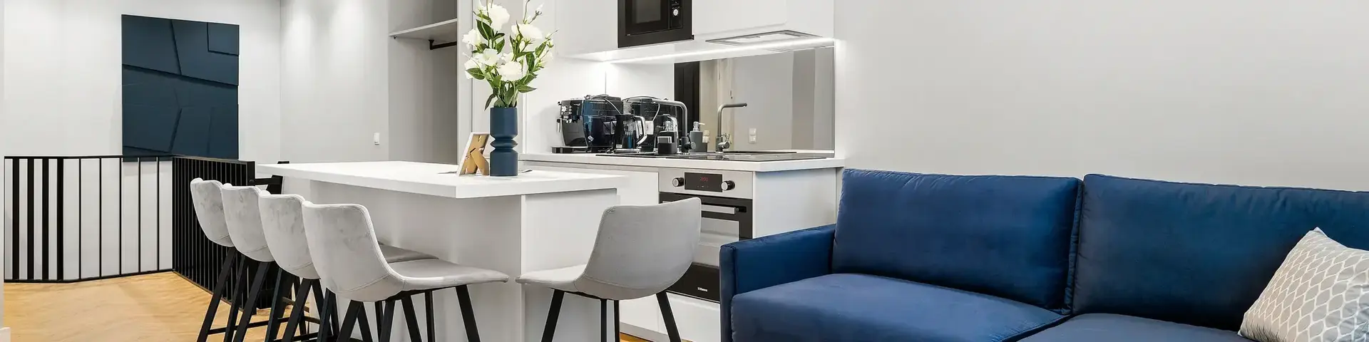 a room with a blue couch and a blue sofa