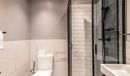a bathroom with a toilet and shower