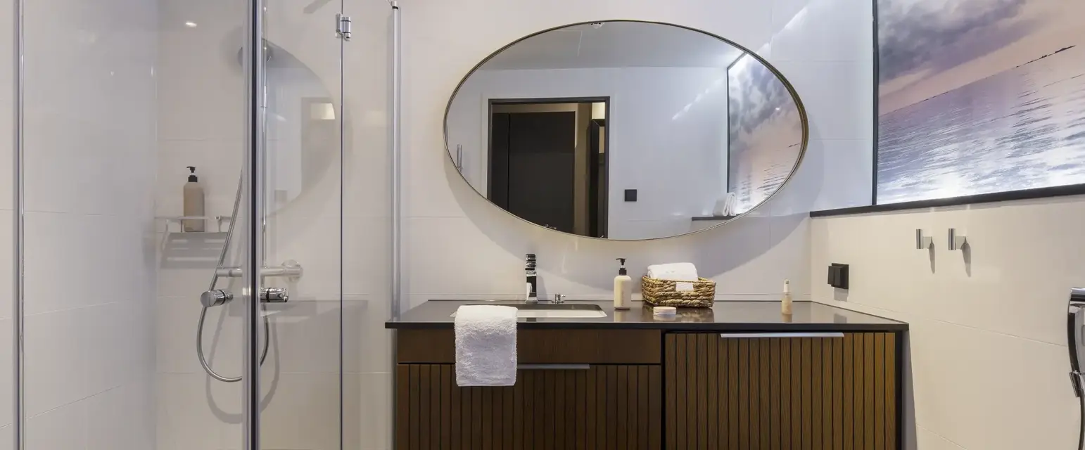 a bathroom with a mirror and a sink