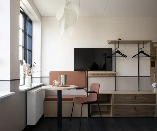 a room with a table and chairs