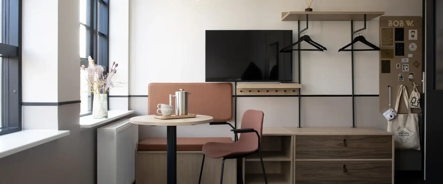 a room with a table and chairs