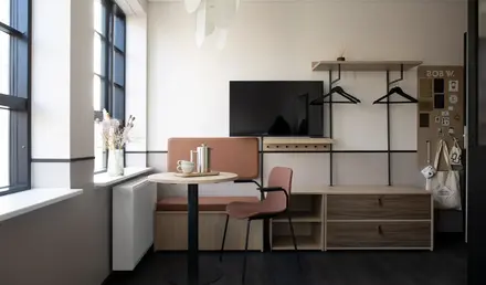 a room with a table and chairs