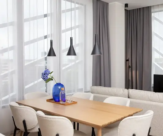 a room with a table and chairs