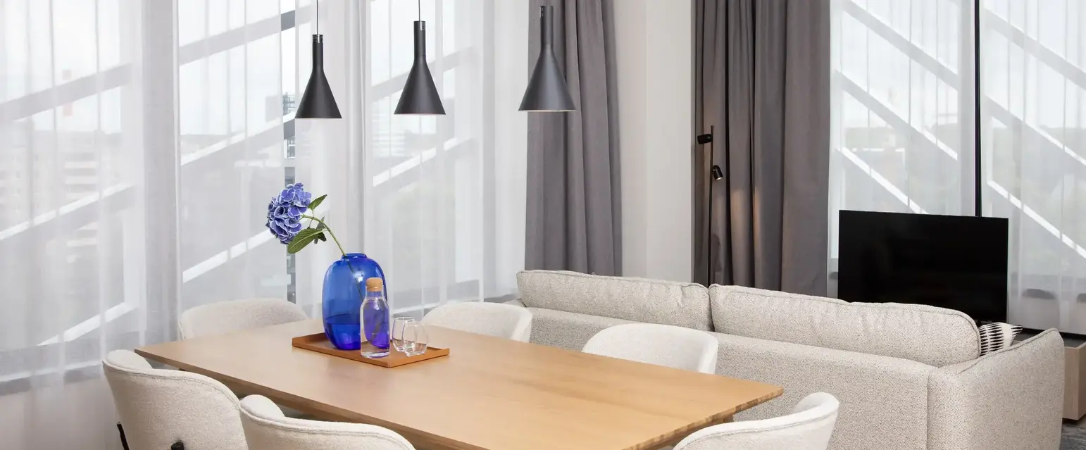 a room with a table and chairs