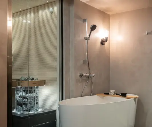 a bathroom with a tub and shower
