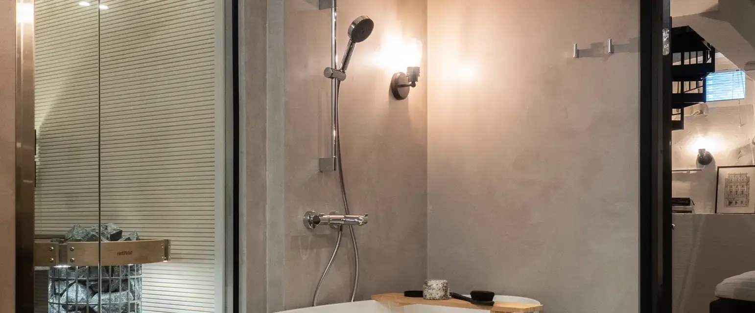 a bathroom with a tub and shower