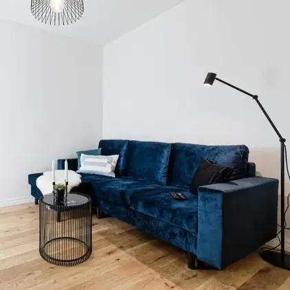 a blue couch in a room