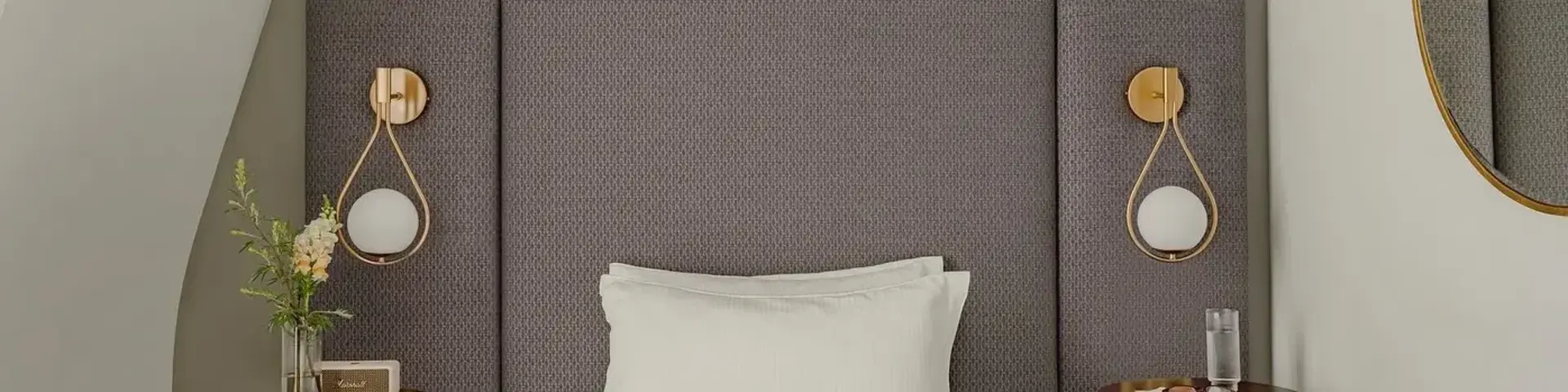 a bed with a magazine and two nightstands