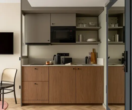 a kitchen with a microwave and a table