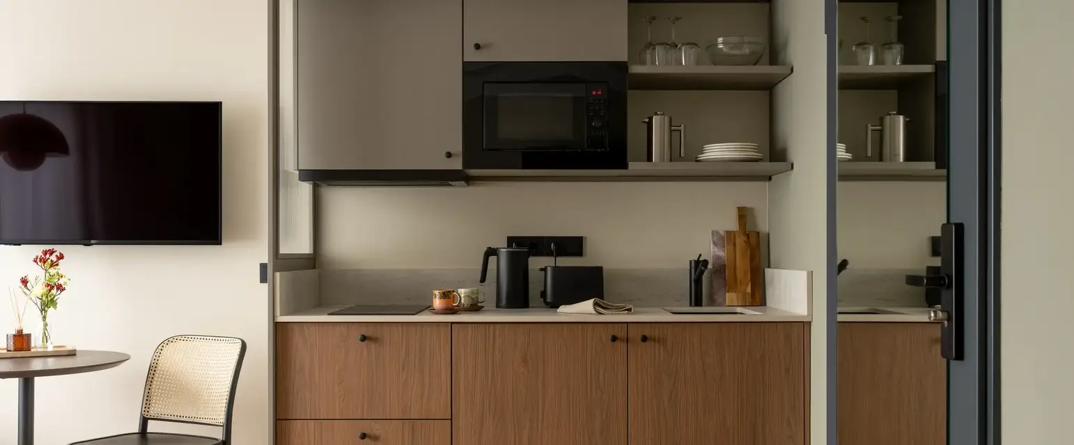 a kitchen with a microwave and a table