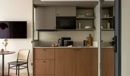 a kitchen with a microwave and a table