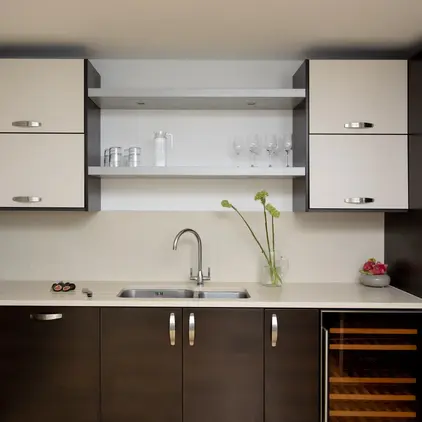 a kitchen with white cabinets and white countertops