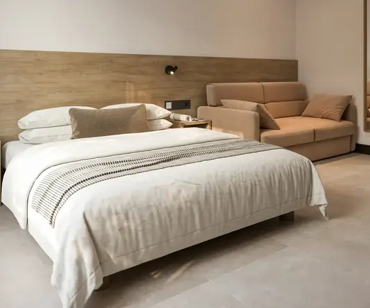 a bed and couch in a room