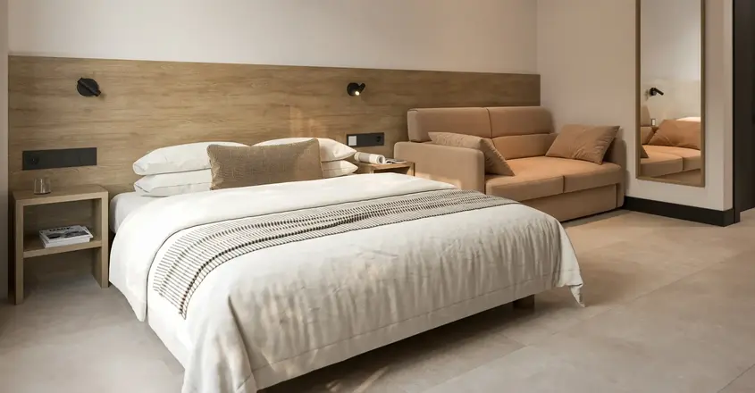 a bed and couch in a room