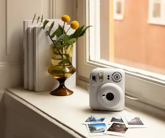 a camera on a window sill