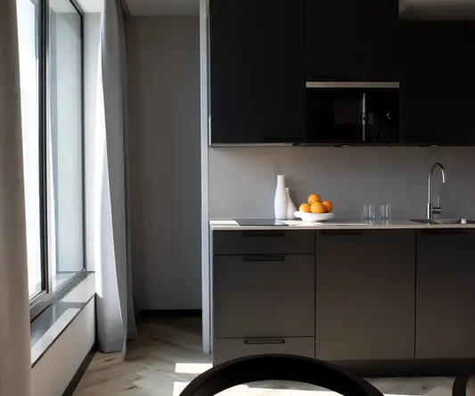 a kitchen with a bowl of oranges