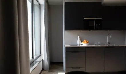 a kitchen with a bowl of oranges